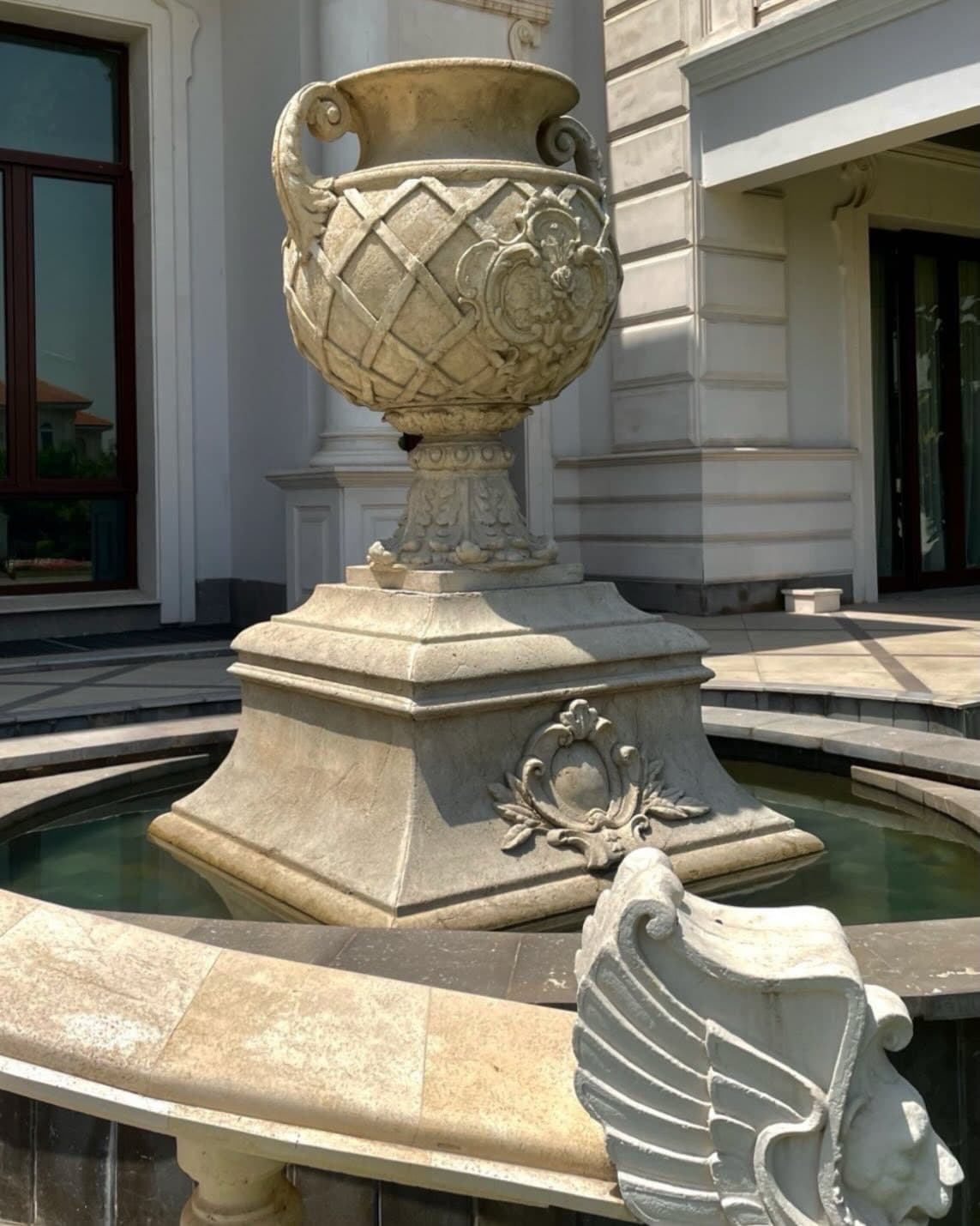 Classical stone fountain: Tranquility crowned with a colossal fountain