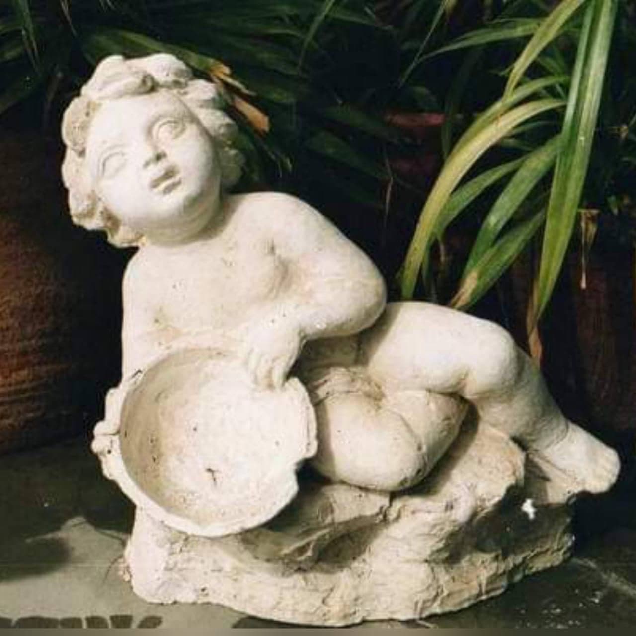 Sculpture by Shahid Hussain: Cupid with bowl